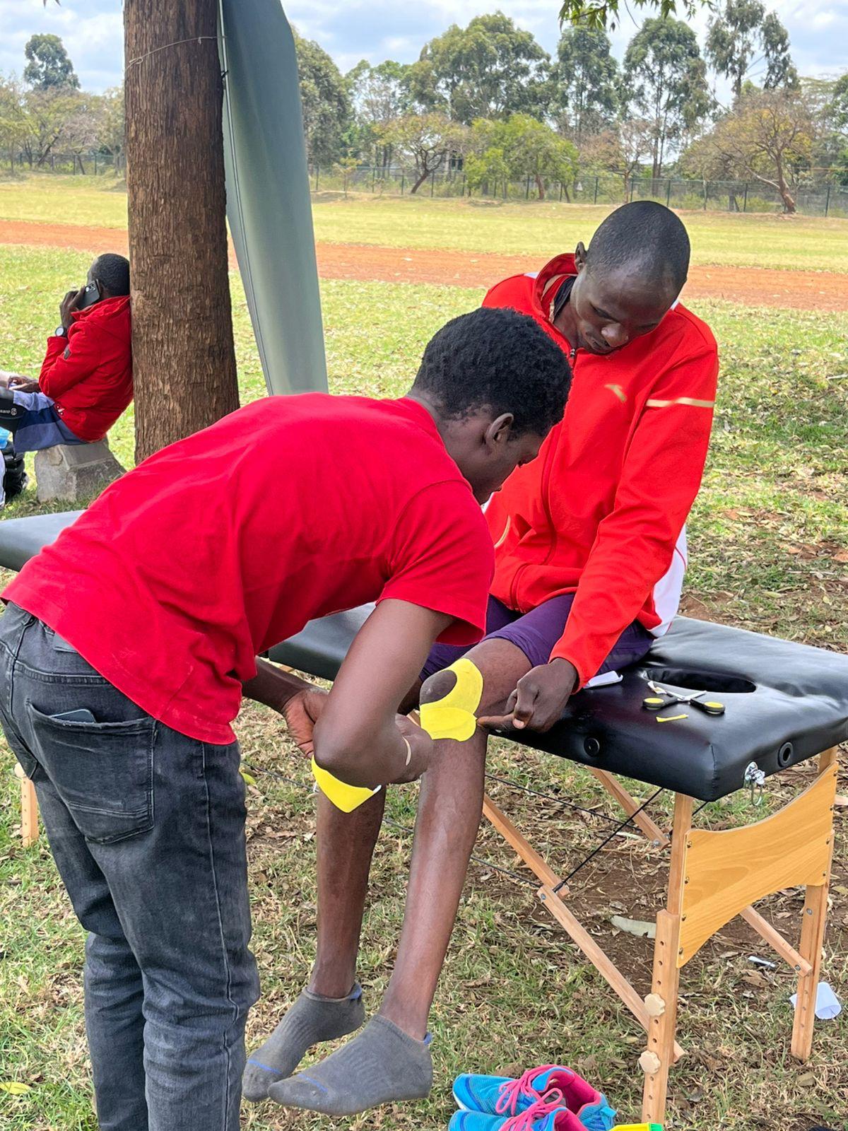 Athlete receiving physiotherapy support during training